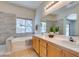 Bathroom featuring a soaking tub, shower, and double vanity at 1274 Doggett Ave, Las Vegas, NV 89123