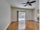 Bedroom features hardwood floors and sliding glass door at 1274 Doggett Ave, Las Vegas, NV 89123