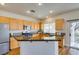 Modern kitchen with stainless steel appliances, island with granite countertops, and stylish cabinets at 1274 Doggett Ave, Las Vegas, NV 89123