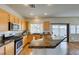 Well-equipped kitchen featuring granite countertops, stainless steel appliances, and ample cabinet space at 1274 Doggett Ave, Las Vegas, NV 89123