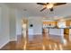 Open concept living space with hardwood floors, adjacent kitchen, and plenty of natural light at 1274 Doggett Ave, Las Vegas, NV 89123