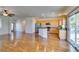 The living room features an open floor plan, and wood floors, seamlessly flowing into the kitchen at 1274 Doggett Ave, Las Vegas, NV 89123
