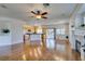 Spacious living area with hardwood floors, fireplace, and seamless kitchen access at 1274 Doggett Ave, Las Vegas, NV 89123