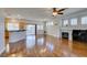 Spacious living area with hardwood floors, fireplace, and a seamless transition to the kitchen at 1274 Doggett Ave, Las Vegas, NV 89123