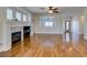 Open living room with hardwood floors, fireplace, and large windows offering plenty of natural light at 1274 Doggett Ave, Las Vegas, NV 89123