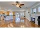Living room featuring hardwood floors, a fireplace, and an open layout connecting the kitchen at 1274 Doggett Ave, Las Vegas, NV 89123