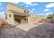 Exterior view of the backyard with a patio, providing ample room for outdoor activities at 1556 Olivia Pkwy, Henderson, NV 89011