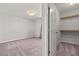 This is a carpeted bedroom with a ceiling light, and a closet at 1556 Olivia Pkwy, Henderson, NV 89011
