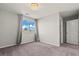 This is a carpeted bedroom featuring neutral walls, a window and access to the bathroom at 1556 Olivia Pkwy, Henderson, NV 89011