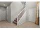 Bright foyer with a staircase and tile floors leading to the upper level at 1556 Olivia Pkwy, Henderson, NV 89011