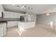 Spacious kitchen with white cabinetry, granite counters, stainless steel appliances, and pendant lights at 1556 Olivia Pkwy, Henderson, NV 89011