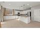 Modern kitchen with white cabinets, stainless steel appliances, and granite countertops at 1556 Olivia Pkwy, Henderson, NV 89011