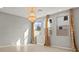 Living room featuring light-colored tile floors, neutral walls, and bright windows at 1556 Olivia Pkwy, Henderson, NV 89011