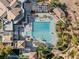 Aerial view of community pool, amenities, and surrounding landscaping at a desert luxury property at 1556 Olivia Pkwy, Henderson, NV 89011