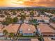 Stunning aerial view showing a neighborhood with well-maintained homes and lush landscaping, backs to the mountains at 1613 Shadow Rock Dr, Las Vegas, NV 89117