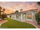 Wonderful backyard, showcasing manicured landscaping and a covered patio, perfect for relaxing at 1613 Shadow Rock Dr, Las Vegas, NV 89117
