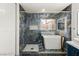 Luxurious bathroom featuring a marble-walled shower and soaking tub with gold hardware at 1613 Shadow Rock Dr, Las Vegas, NV 89117