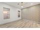 Open bedroom with modern ceiling fan and accent wall at 1613 Shadow Rock Dr, Las Vegas, NV 89117