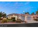 Inviting single-story home featuring a two-car garage, desert landscaping, and a classic design at 1613 Shadow Rock Dr, Las Vegas, NV 89117
