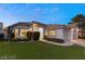 Attractive single-story home featuring a well-maintained lawn, mature landscaping, and a two-car garage at 1613 Shadow Rock Dr, Las Vegas, NV 89117