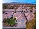 Charming single-story home with a tile roof, two-car garage, and beautifully manicured lawn against a mountain backdrop at 1613 Shadow Rock Dr, Las Vegas, NV 89117