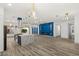 Open-concept kitchen with a large marble island and stainless steel appliances at 1613 Shadow Rock Dr, Las Vegas, NV 89117