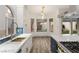 Bright kitchen featuring marble countertops, stainless steel appliances, and outdoor views at 1613 Shadow Rock Dr, Las Vegas, NV 89117