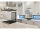 Bright kitchen featuring a large marble island and blue tile backsplash at 1613 Shadow Rock Dr, Las Vegas, NV 89117