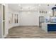 Spacious open-concept kitchen and living area with wood-style flooring at 1613 Shadow Rock Dr, Las Vegas, NV 89117