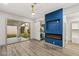 Main bedroom with a sliding glass door, blue accent wall, and large closet at 1613 Shadow Rock Dr, Las Vegas, NV 89117