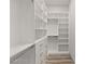 Custom walk-in closet with built-in shelving and drawer system at 1613 Shadow Rock Dr, Las Vegas, NV 89117