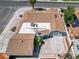 Aerial view of a home featuring a well-kept roof, backyard patio, and desert landscaping at 1700 E Oakey Blvd, Las Vegas, NV 89104