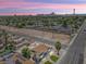 Aerial view showcasing a well-maintained home with a pool and nearby city skyline at 1700 E Oakey Blvd, Las Vegas, NV 89104