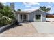 A backyard with a patio, palm tree and sliding glass door at 1700 E Oakey Blvd, Las Vegas, NV 89104