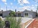 A backyard with a patio, shrubs and a patch of green lawn at 1700 E Oakey Blvd, Las Vegas, NV 89104