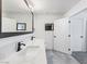 Bathroom vanity features double sinks, white quartz countertops, and black fixtures at 1700 E Oakey Blvd, Las Vegas, NV 89104