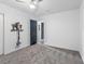 Bedroom featuring neutral carpet, an ensuite bathroom and modern ceiling fan at 1700 E Oakey Blvd, Las Vegas, NV 89104
