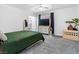 Well-lit bedroom featuring gray carpet, modern furnishings, and a tranquil minimalist aesthetic at 1700 E Oakey Blvd, Las Vegas, NV 89104
