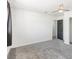 Freshly painted bedroom featuring a ceiling fan, neutral carpet and an ensuite bathroom at 1700 E Oakey Blvd, Las Vegas, NV 89104