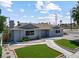 Charming single-story home with manicured landscaping and a welcoming walkway at 1700 E Oakey Blvd, Las Vegas, NV 89104