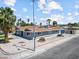 Well-maintained single-story home boasts mature palm trees, xeriscaping, and a long driveway at 1700 E Oakey Blvd, Las Vegas, NV 89104
