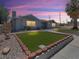 Charming single-story home featuring a well-maintained lawn, neutral stucco, and lush landscaping at 1700 E Oakey Blvd, Las Vegas, NV 89104