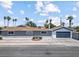 Charming single-story home with a well-maintained front yard and attached garage, perfect for suburban living at 1700 E Oakey Blvd, Las Vegas, NV 89104
