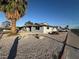 Charming single-story home features a low maintenance, desert-landscaped front yard with mature palm tree at 1700 E Oakey Blvd, Las Vegas, NV 89104