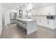 Bright kitchen featuring modern white cabinets, a quartz island with seating, and stainless steel appliances at 1700 E Oakey Blvd, Las Vegas, NV 89104