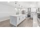Bright kitchen features stainless steel appliances, double oven, modern white cabinets, and a quartz island at 1700 E Oakey Blvd, Las Vegas, NV 89104