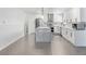 Bright kitchen features stainless steel appliances, double oven, modern white cabinets, and a quartz island at 1700 E Oakey Blvd, Las Vegas, NV 89104
