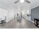 Open concept kitchen featuring modern white cabinets, a quartz island, and stainless steel appliances at 1700 E Oakey Blvd, Las Vegas, NV 89104