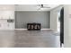 Open living space with gray walls, wood floors, ceiling fan, and black accent cabinets at 1700 E Oakey Blvd, Las Vegas, NV 89104