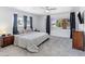 Bright main bedroom with large windows, ceiling fan, and neutral décor at 1700 E Oakey Blvd, Las Vegas, NV 89104